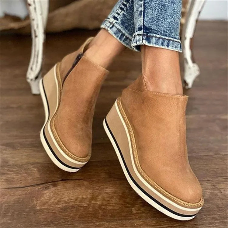 Ankle boots worn with cropped jeans